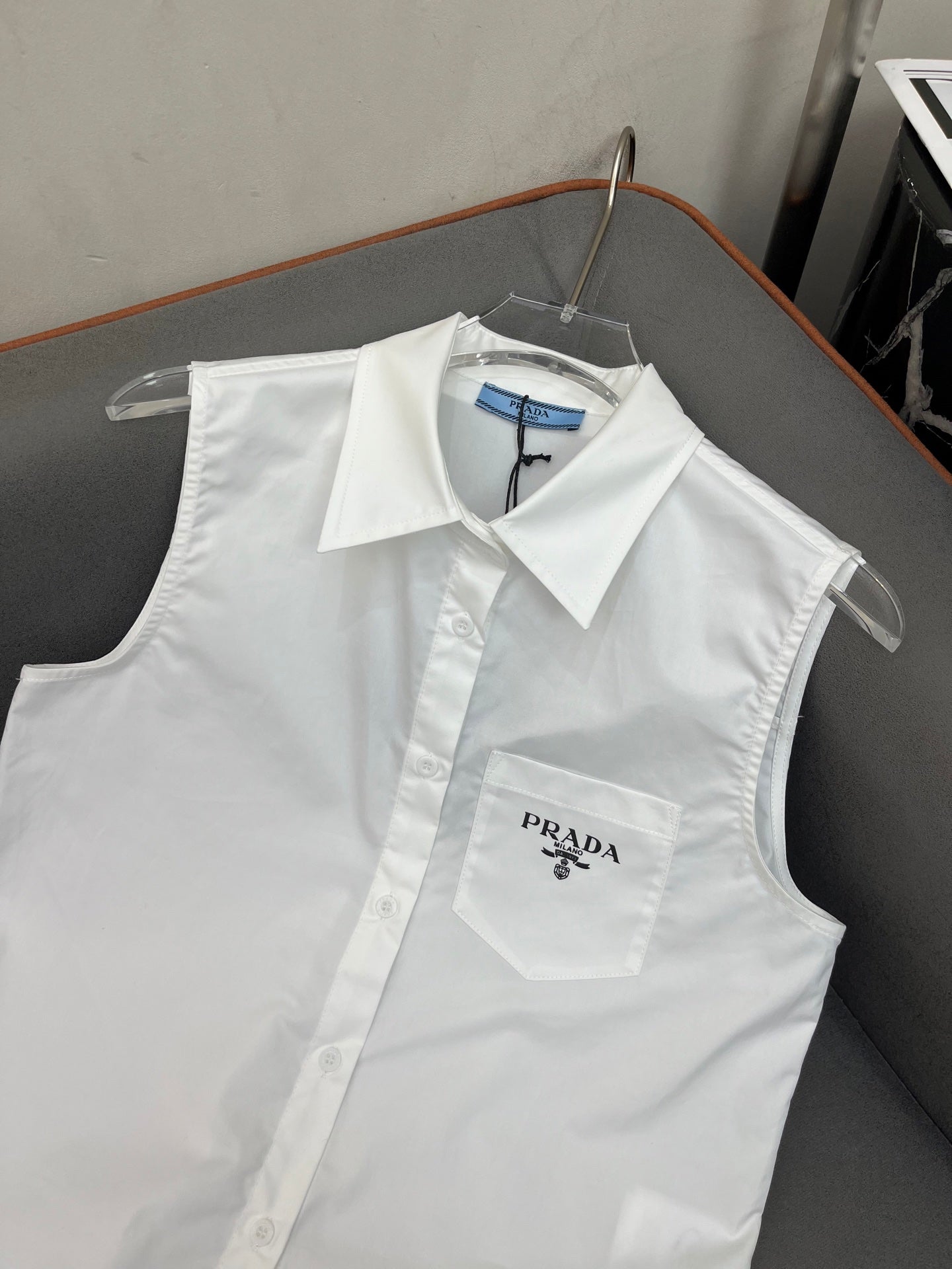 PRADA WHITE SLEEVELESS BUTTON-UP SHIRT